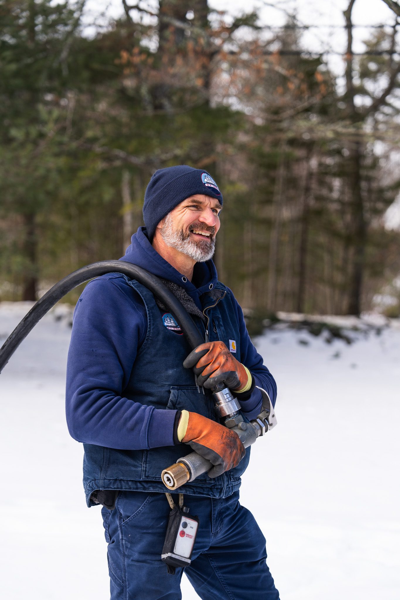 Dedicated and reliable propane delivery from our expert service team. Propane delivery driver Jason holding a fuel hose during a professional residential service call.