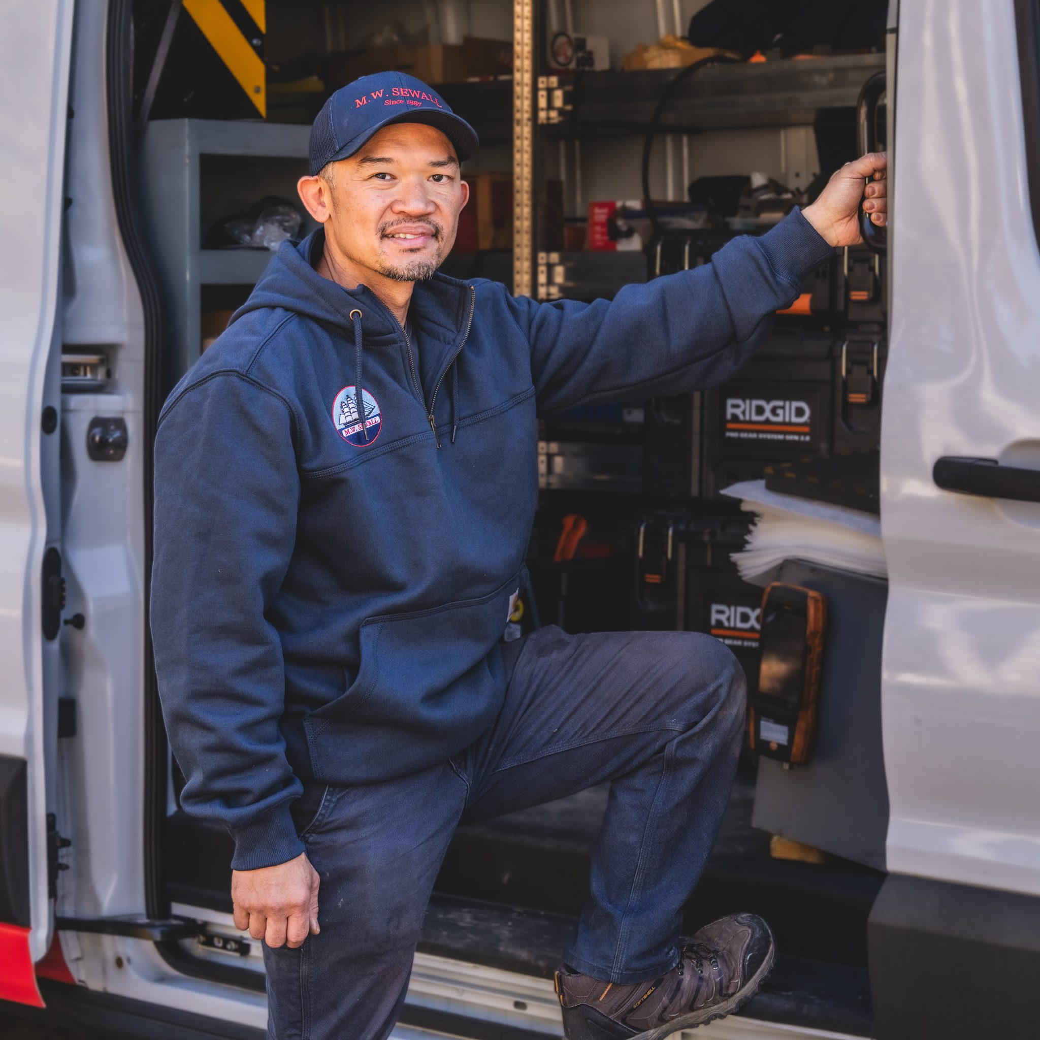 24/7 Expert Heating System Care: From boilers to traditional furnaces, we've got you covered. M.W. Sewall expert service technician performing a high-efficiency boiler tune-up in Maine.