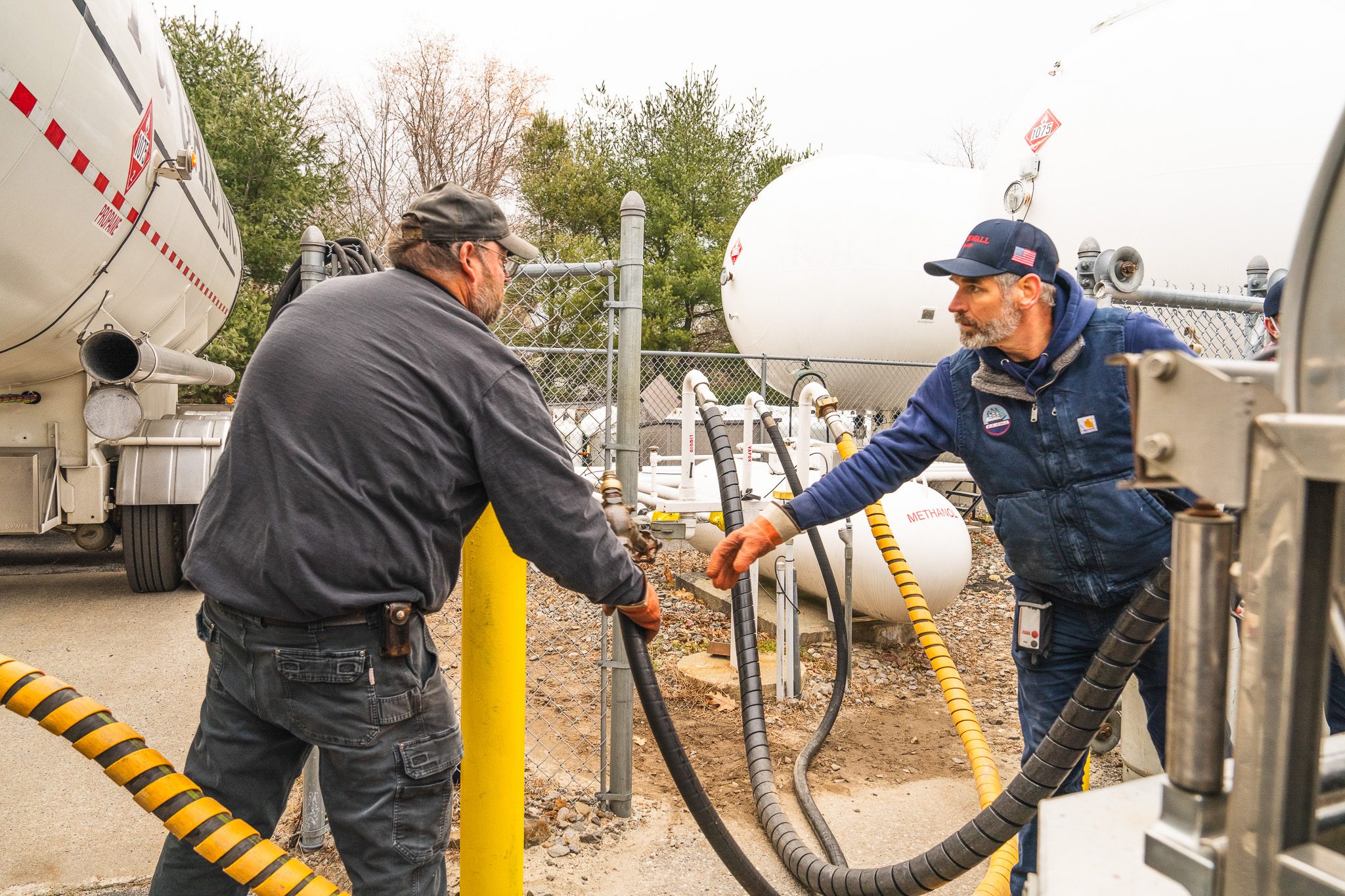 DSC01587 propane delivery driver Jason Morris, making a fuel delivery to customer house in Bath, Maine.