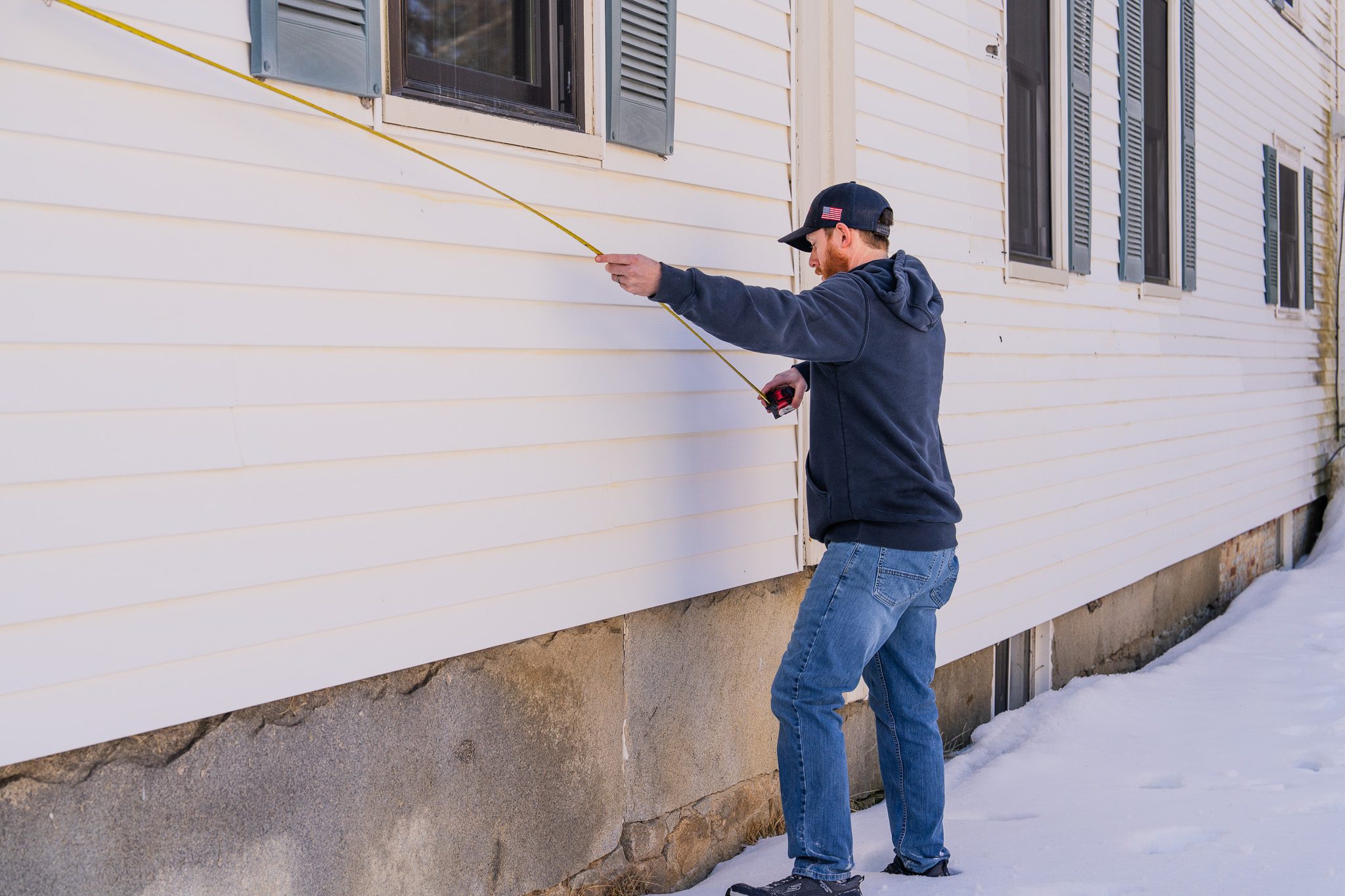 Service Advisor Nate Rioux from M.W. Sewall Service advisor form M.W. Sewall uses tape measure for installing propane tanks